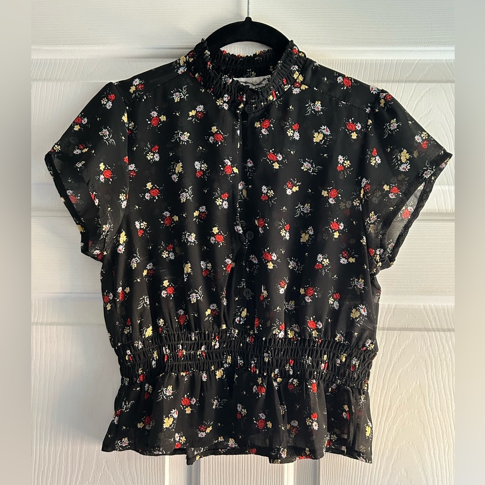Black sheet short sleeve floral blouse with shirred waist and neckline